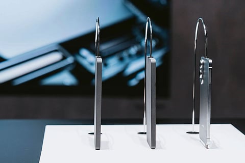 The Samsung Galaxy S25 Edge (right), next to models of the bigger Galaxy 23 and Galaxy 24.