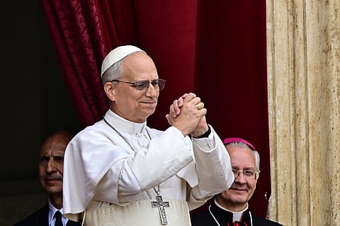 Pope Leo XIV gestures after delivering the Regina Caeli prayer from the main central loggia of St Peter's basilica in The Vatican, on May 11, 2025.