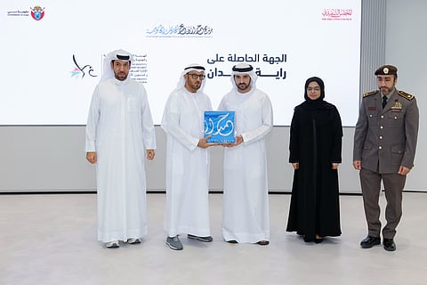 Sheikh Hamdan bin Mohammed bin Rashid Al Maktoum giving Hamdan Flag to Lt Gen Mohammed Ahmed Al Marri, Director General of the GDRFA at a ceremony in Dubai