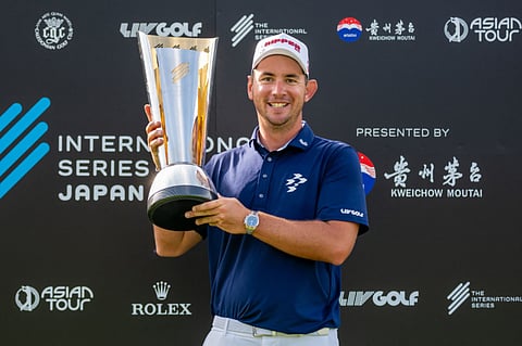 Lucas Herbert of Australia with the trophy after he wins the 2025 International Series Japan at Caledonian Golf Club in Chiba.