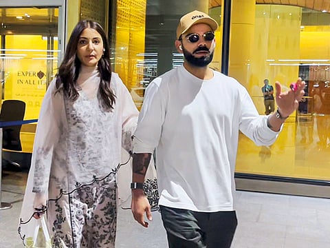 Virat Kohli and his wife Anushka Sharma on their arrival at Mumbai airport on Tuesday.