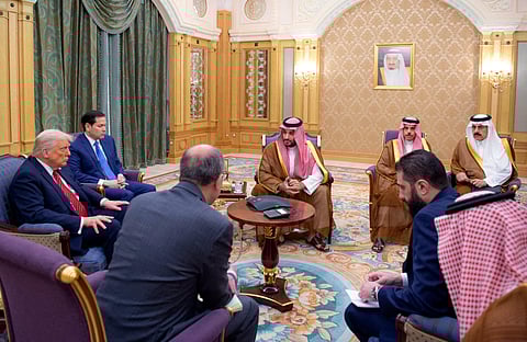 Trump (left), Secretary of State Marco Rubio (second left), Syria's interim president Ahmed Al Sharaa (right), Saudi Crown Prince Mohammed bin Salman (centre) and Saudi Foreign Minister Faisal bin Farhan (second right) during their meeting in Riyadh on May 14, 2025.