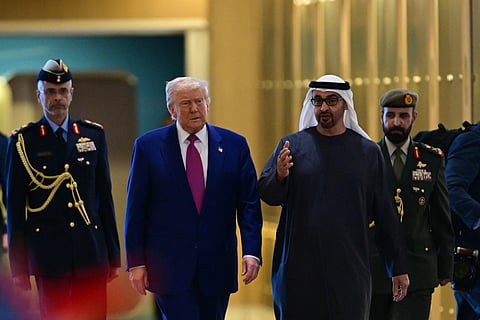 UAE President Sheikh Mohamed bin Zayed Al Nahyan (R) welcomes his US counterpart Donald Trump upon arrival at the presidential terminal in Abu Dhabi on May 15, 2025.