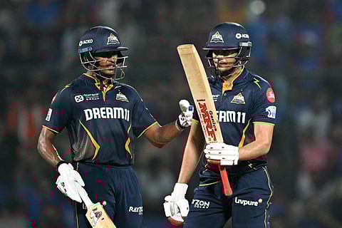 Gujarat Titans' captain Shubman Gill (right) celebrates with his teammate Sai Sudharsan during the Indian Premier League match against Delhi Capitals on Sunday.