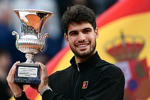 Spain's Carlos Alcaraz holds the Italian Open winner's after defeating Italy's Jannik Sinner in Rome on Sunday.