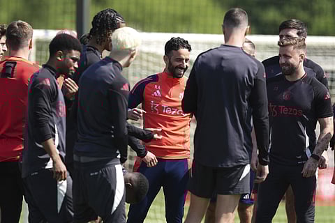 Manchester United's manager Ruben Amorim (centre) smiles during a training session in Manchester on Tuesday May 20, 2025, ahead of the Europa League final against Tottenham.