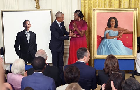 Former U.S. President Barack Obama and former first lady Michelle Obama unveil their official White House portraits during a ceremony at the White House on September 7, 2022 in Washington, DC.