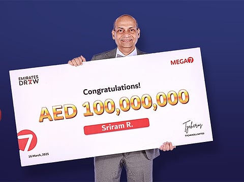 Sriram Rajagopalan with the ceremonial cheque for the whopping $27million jackpot.