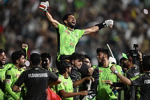 Lahore Qalanders' players carry teammate Sikandar Raza as they celebrate their victory in the Pakistan Super League (PSL) Twenty20 final against Quetta Gladiators at the Gaddafi Stadium on Sunday.