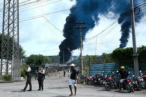 A thick cloud of smoke rises during a fire at the oil refinery in Esmeraldas, Ecuador, on May 26, 2025.