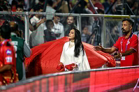 Punjab Kings' co-owner Preity Zinta (centre) distributes the team's jerseys to spectators during the Indian Premier League match against Mumbai Indian in Jaipur on Monday.