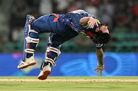 Lucknow Super Giants' captain Rishabh Pant performs somersault to celebrate after scoring a century during the Indian Premier League match aganst Royal Challengers Bengaluru on Tuesday.