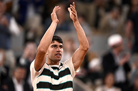 Spain's Carlos Alcaraz celebrates after winning against Hungary's Fabian Marozsan at the Roland-Garros Complex in Paris on Wednesday.
