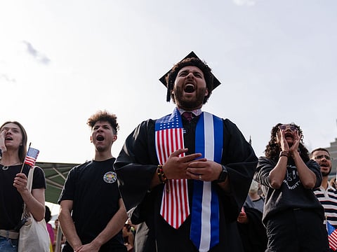 A Harvard University student, chants with fellow demonstrators during a protest in support of international students at Harvard University in Cambridge, Massachusetts, on Tuesday, May 27, 2025.