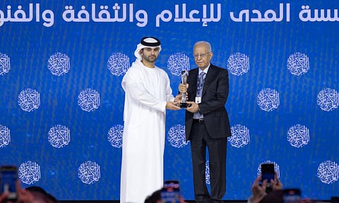 Sheikh Mansoor bin Mohammed presents the Media Personality of the Year award to Iraqi journalist Fakhri Karim at the Arab Media Summit in Dubai