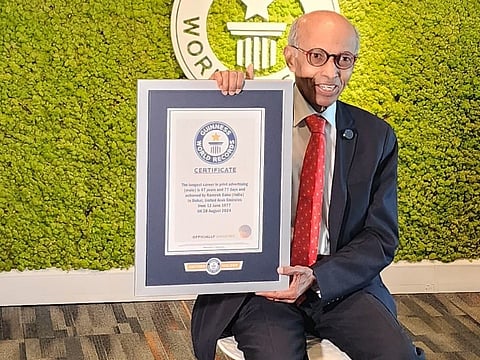 Dubai advertising pioneer Ramesh Babu displays the certificate from the Guinness authorities recognising his 47-year contribution to the field.