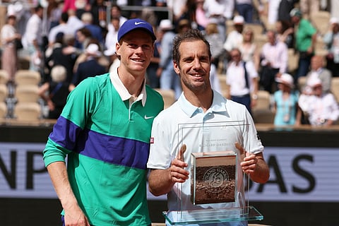 Italy's Jannik Sinner (left) poses with France's Richard Gasquet after the Frenchman's last match in his career at French Open on Thursday.