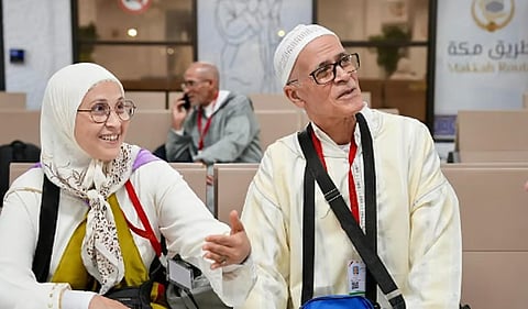 Hajja Naima and her husband wait at Morocco’s King Mohammed V airport to fly to Saudi Arabia.