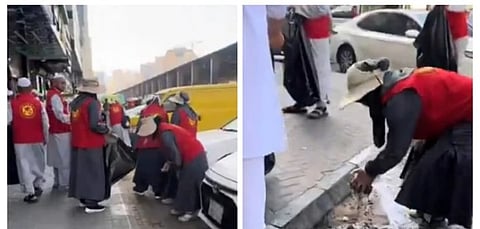 Chinese pilgrims clean up outside their residence in Mecca.