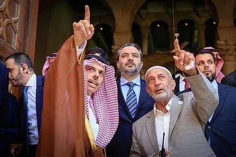 Syria's interim foreign minister Asaad Shaibani (centre) accompanying Saudi Arabia's Foreign Minister Prince Faisal bin Farhan (centre left) during the latter's visit to the Umayyad Mosque in the old city of Damascus on May 31, 2025.