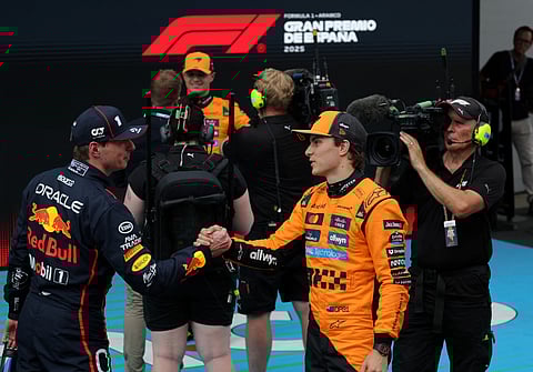 Pole position winner McLaren's Oscar Piastri is greeted by Red Bull's Max Verstappen (left) after the qualification session at the Circuit de Catalunya in Montmelo, on the outskirts of Barcelona, on Saturday.
