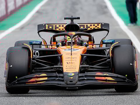 McLaren driver Oscar Piastri of Australia steers his car to parc ferme after the qualifying session ahead of the Spanish Grand Prix Formula One race at the Barcelona Catalunya racetrack in Montmelo, near Barcelona, Spain, Saturday, May 31, 2025. (AP Photo/Joan Monfort)
