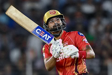 Punjab Kings' captain Shreyas Iyer watches the ball after playing a shot during the Indian Premier League (IPL) Twenty20 second Qualifier cricket match between Punjab Kings and Mumbai Indians at the Narendra Modi Stadium in Ahmedabad on June 2, 2025.