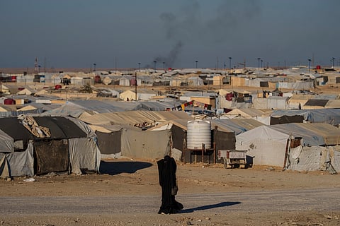 A woman walks in the al-Hol camp in northeastern Syria's Hasakeh province, where tens of thousands of mostly women and children linked to the Islamic State group have been living for years. File photo taken on Thursday, Jan. 30, 2025.