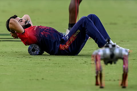 Royal Challengers Bengaluru's Virat Kohli warms up before the start of the Indian Premier League (IPL) Twenty20 final.