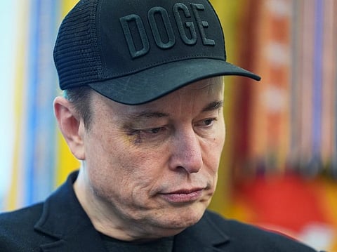 Elon Musk attends a news conference with President Donald Trump in the Oval Office of the White House.