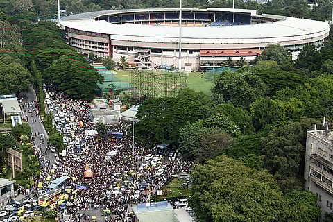 Fans throng outside the M. Chinnaswamy Stadium in Bengaluru on June 4, 2025, to celebrate a day after Royal Challengers Bengaluru's victory in the Indian Premier League (IPL) Twenty20 final.
