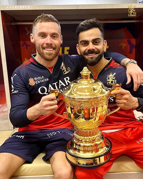 Phil Salt with Virat Kohli and the Indian Premier League trophy after the final on Tuesday.
