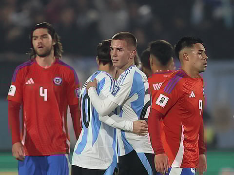 Argentina's Lionel Messi embraces Franco Mastantuono after winning the 2026 Fifa World Cup South American qualifiers against Chile in Santiago on Thursday.