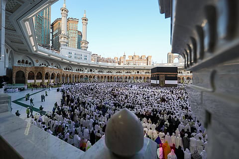 Muslims participate in a special morning prayer around the Kaaba, Islam's holiest shrine, at the Grand Mosque complex in Mecca.