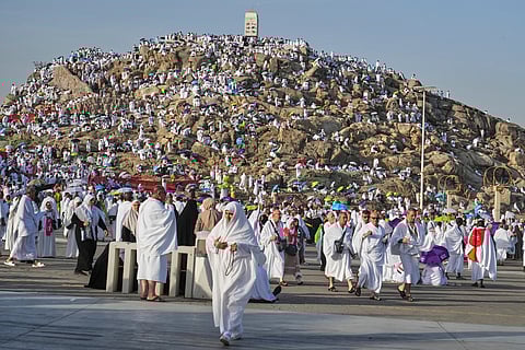 Muslim pilgrims gather on top of the rocky hill known as the Mountain of Mercy, on the Plain of Arafat, during the annual Hajj pilgrimage near the holy city of Mecca, Saudi Arabia, Thursday, June 5, 2025.