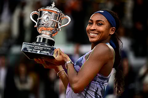 US Coco Gauff holds the trophy after winning the French Open tennis tournament women's singles final match.