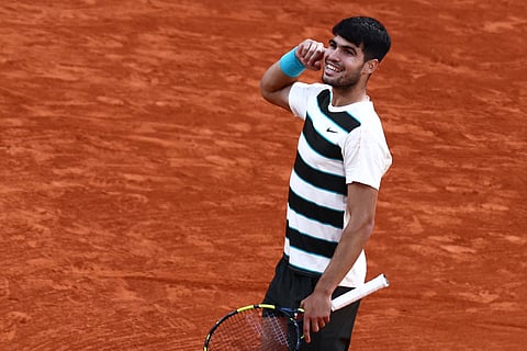 Spain's Carlos Alcaraz reacts after winning a point during his men's singles final match against Italy's Jannik Sinner on day 15 of the French Open tennis tournament on Court Philippe-Chatrier at the Roland-Garros Complex in Paris on June 8, 2025.