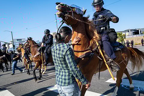 The National Guard, police and protesters clash following two days of protests after a series of immigration raids on June 08, 2025 in Los Angeles, California.
