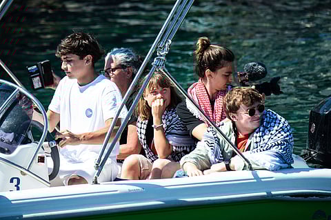 Climate activist Greta Thunberg, centre, waits to board the Madleen boat, before setting sail for Gaza along with activists of the Freedom Flotilla Coalition, departing from the Sicilian port of Catania, Italy, Sunday, June 1, 2025.