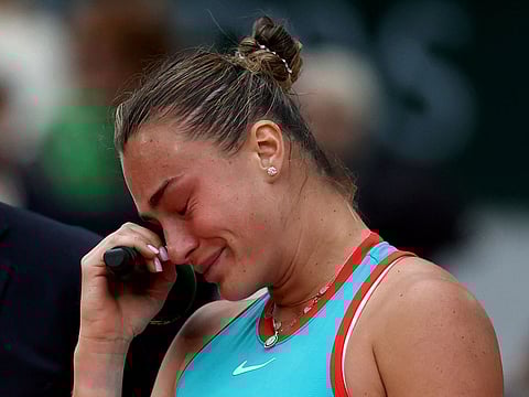 Belarus' Aryna Sabalenka is in tears after receiving her runners-up trophy on Court Philippe-Chatrier at the Roland-Garros Complex in Paris on Saturday.