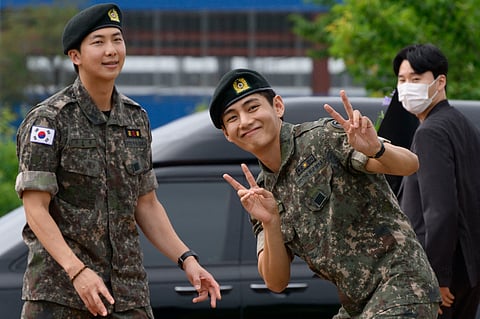 BTS' RM and V return from military service in style.
