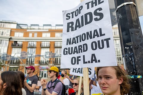 Protesters denounce the ongoing raids and deportations by US Immigration and Customs Enforcement (ICE) during a demonstration in Columbia Heights on June 10, 2025 in Washington, DC.