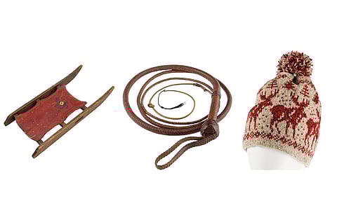 This combination of images shows the Rosebud sled from the film “Citizen Kane," left, a whip wielded by Harrison Ford in “Indiana Jones and the Last Crusade," center, and the knit hat worn by Macaulay Culkin in the film "Home Alone." (Heritage Auctions via AP)
