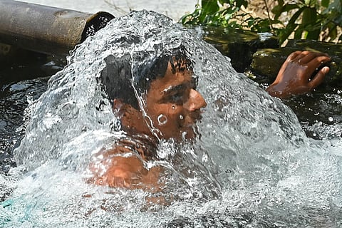 On a blistering summer day in the outskirts of Amritsar, a young boy seeks refuge from the oppressive heat by cooling himself in a tubewell. With the temperature soaring, he stands knee-deep in the cool, refreshing water, his face relaxed as he tries to beat the relentless heat.
