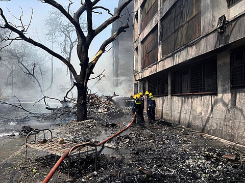 Firefighters work at the site of an Air India plane that crashed in India's northwestern city of Ahmedabad in Gujarat state, Thursday, June 12, 2025