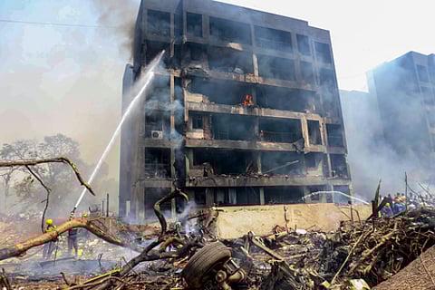Firefighters at the site of the Air India plane crash in Ahmedabad.