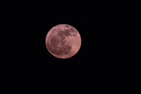 The Strawberry Moon as seen from Maliha road in Sharjah on June 11, 2021.