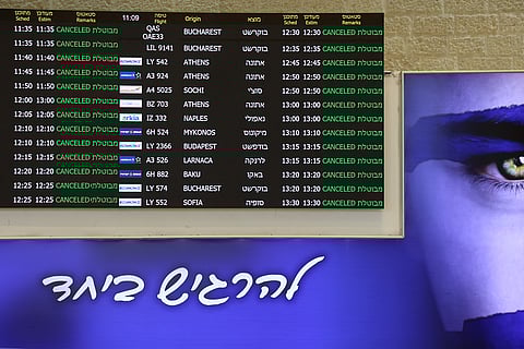 A board showing cancelled flights stands at arrivals hall at Ben Gurion Airport near Tel Aviv on June 13, 2025 after Israel closed its air space to takeoff and landing.