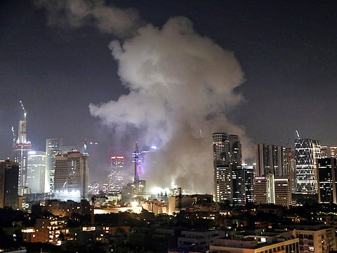 Smoke billows following a missile attack from Iran, in Tel Aviv on Saturday.