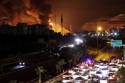 Israel’s attacks expanded to include energy infrastructure. Fuel depots around Tehran were hit, and a power plant in Haifa was seen burning after a missile strike.
